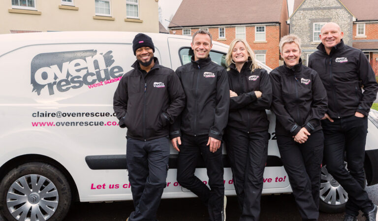 Oven rescue cleaning franchise team members with a van