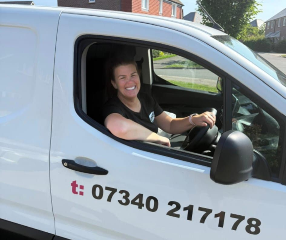 Smiling woman sat in an Oven Rescue Van
