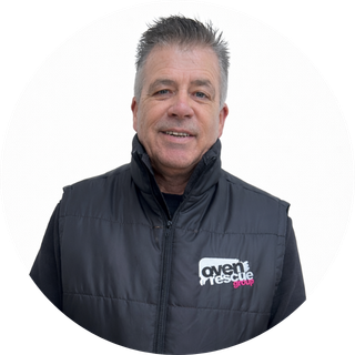 Smiling man in Oven Rescue gilet, the owner of Oven Rescue Guildford