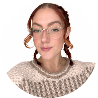 picture of a girl with glasses, smiling